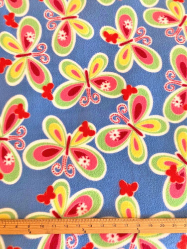 Lilly Craft Butterflies on Blue Fleece Print Fabric is 58-60